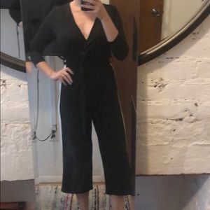 Black jumpsuit with white strip down legs